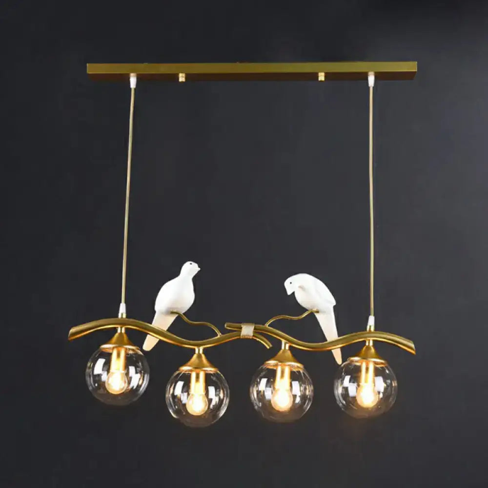 Modern bird branch island pendant light – dining room amber glass