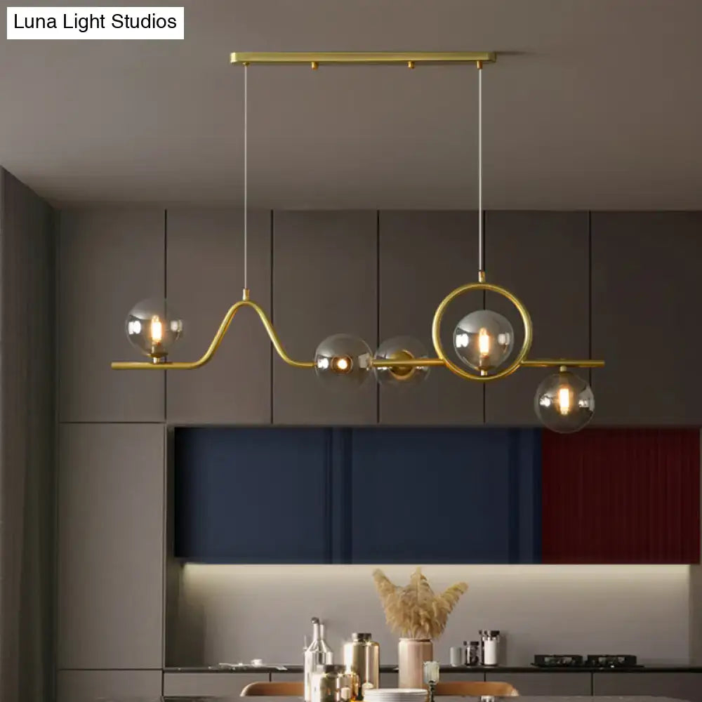 Modern gold curve island ceiling light with bird for dining room