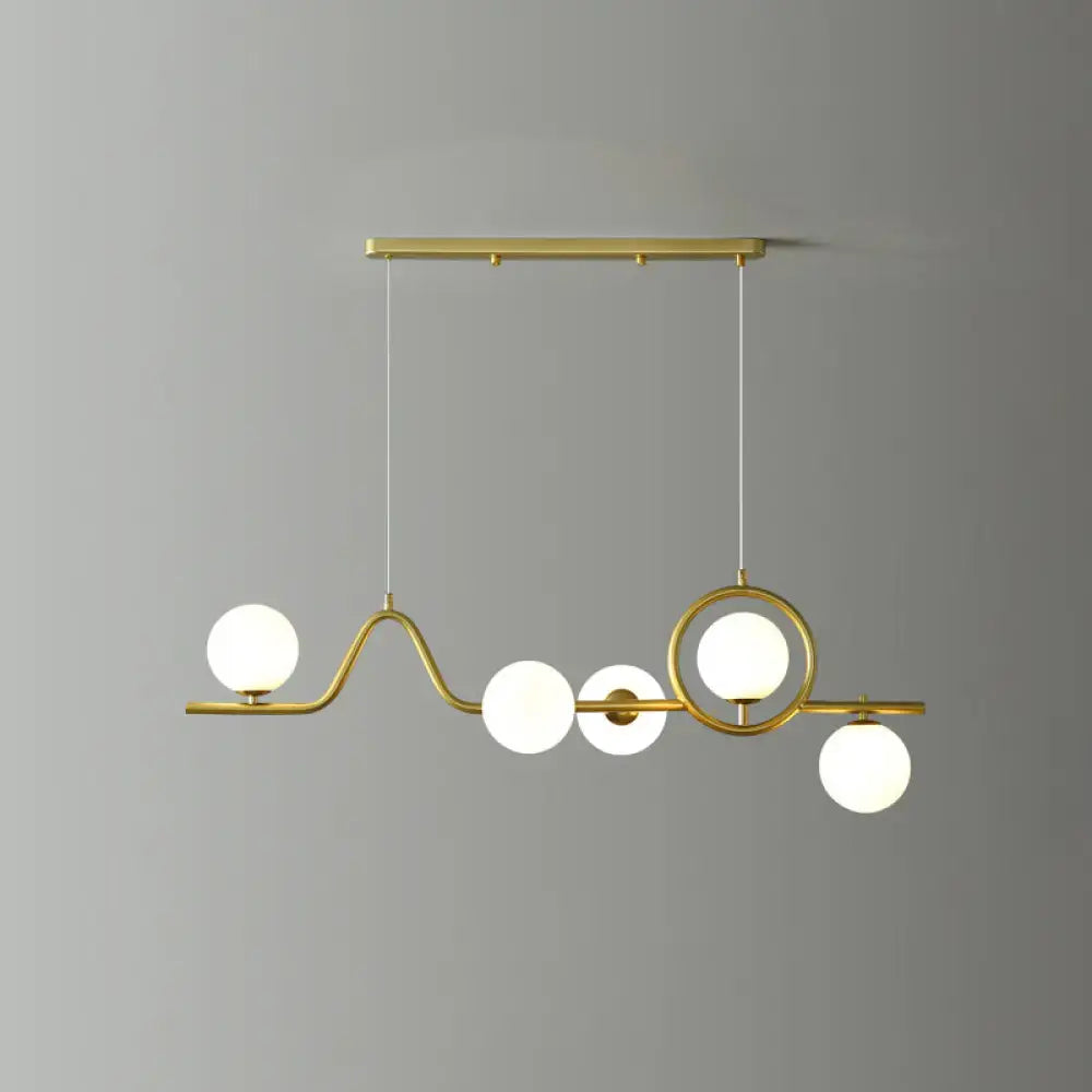 Modern gold curve island ceiling light with bird for dining room