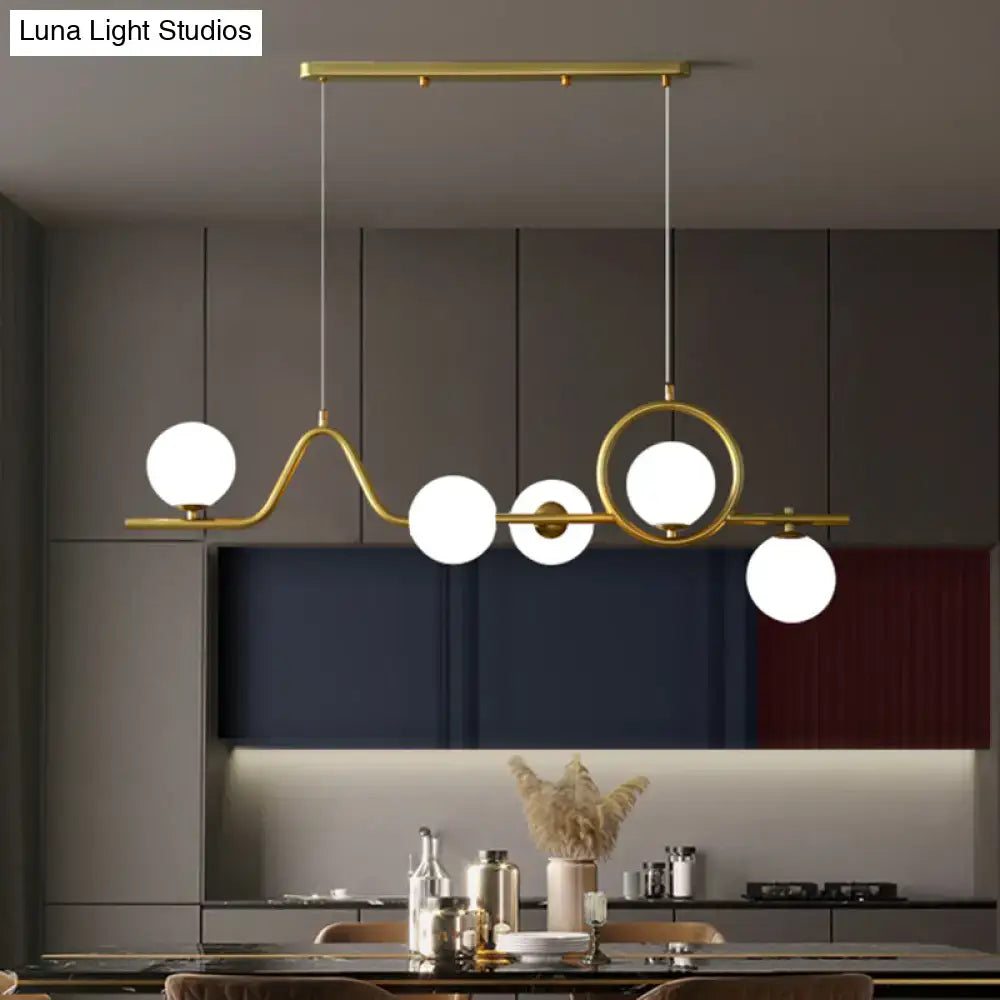 Modern gold curve island ceiling light with bird for dining room