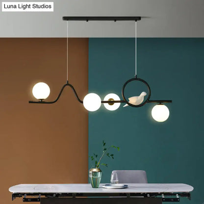 Modern gold curve island ceiling light with bird for dining room