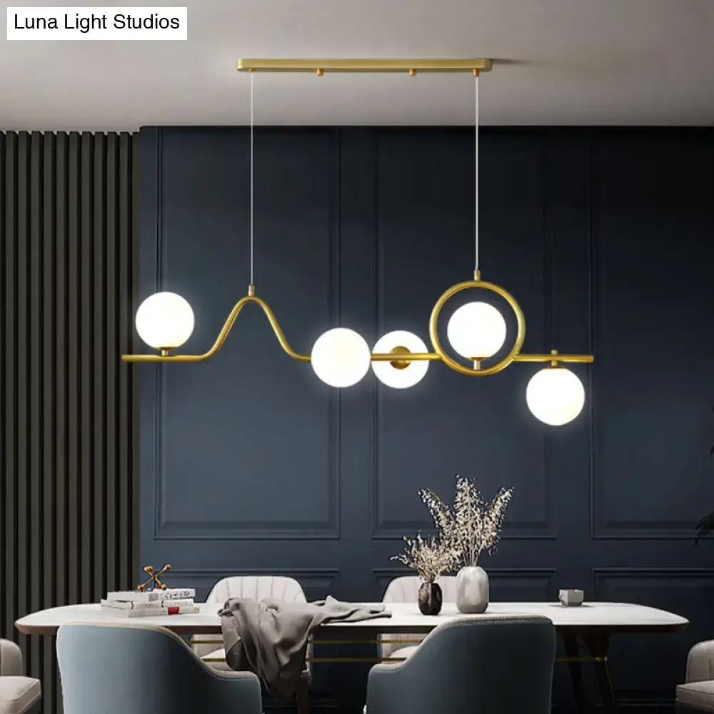 Modern gold curve island ceiling light with bird for dining room