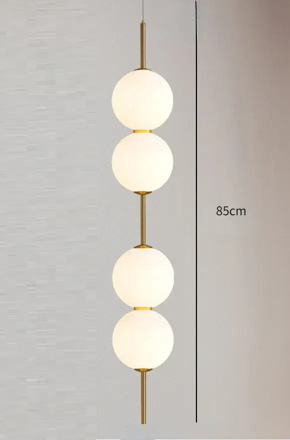 Modern gold glass pendant lighting – dining room spherical bulbs