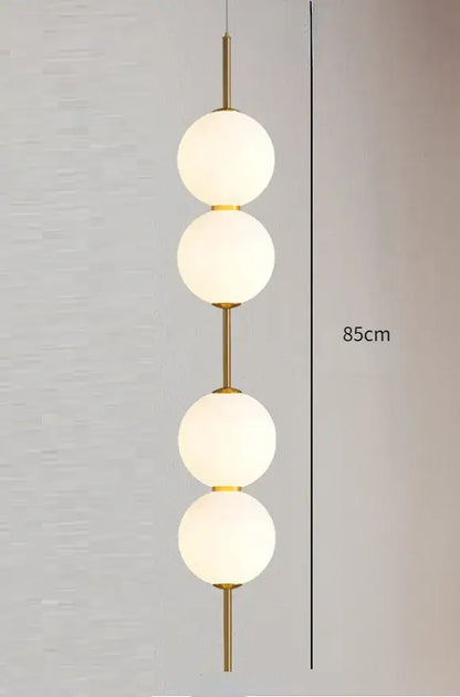 Modern gold glass pendant lighting – dining room spherical bulbs
