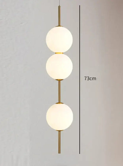 Modern gold glass pendant lighting – dining room spherical bulbs