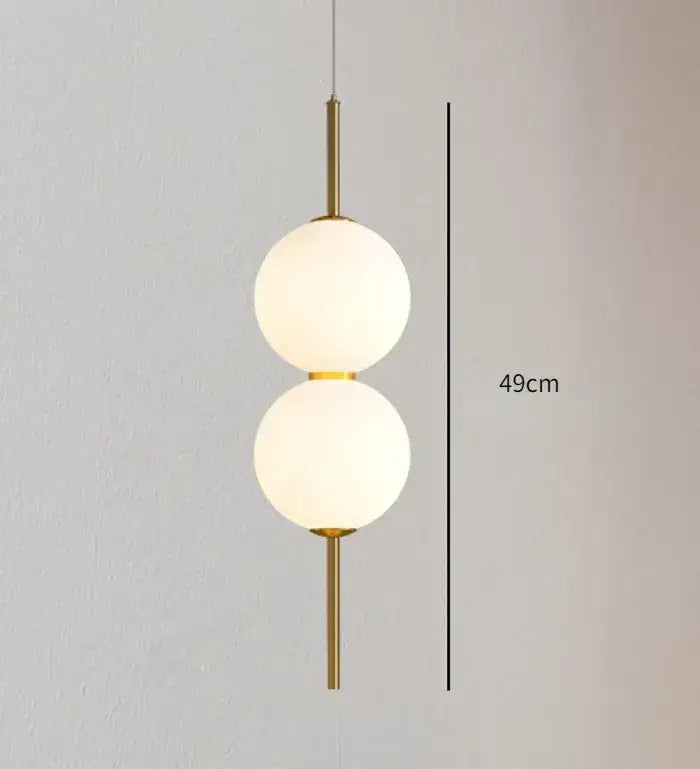 Modern gold glass pendant lighting – dining room spherical bulbs