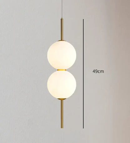 Modern gold glass pendant lighting – dining room spherical bulbs