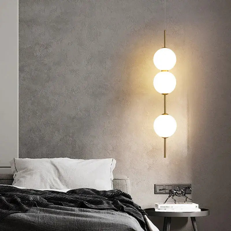 Modern gold glass pendant lighting – dining room spherical bulbs