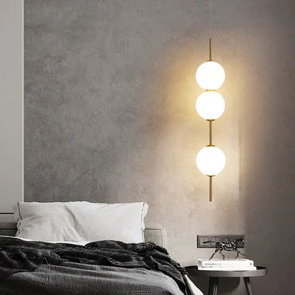 Modern gold glass pendant lighting – dining room spherical bulbs