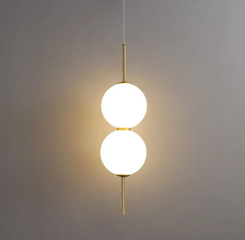 Modern gold glass pendant lighting – dining room spherical bulbs