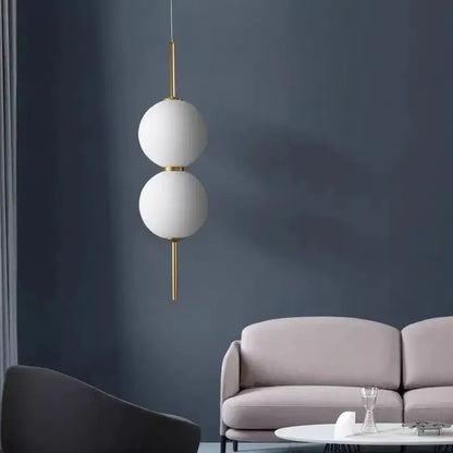 Modern gold glass pendant lighting – dining room spherical bulbs