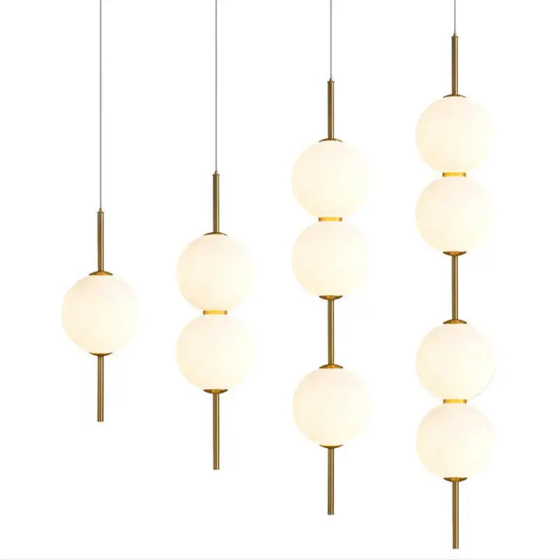 Modern gold glass pendant lighting – dining room spherical bulbs