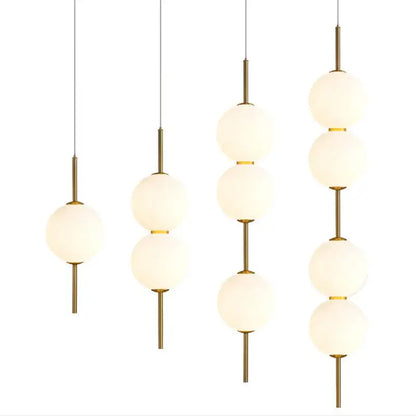 Modern gold glass pendant lighting – dining room spherical bulbs