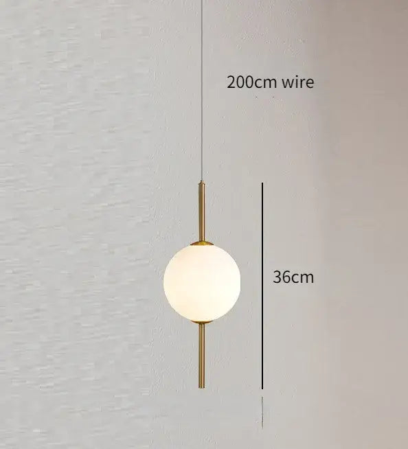 Modern gold glass pendant lighting – dining room spherical bulbs