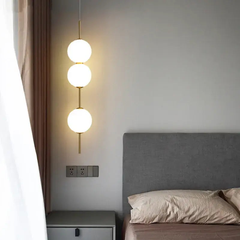 Modern gold glass pendant lighting – dining room spherical bulbs