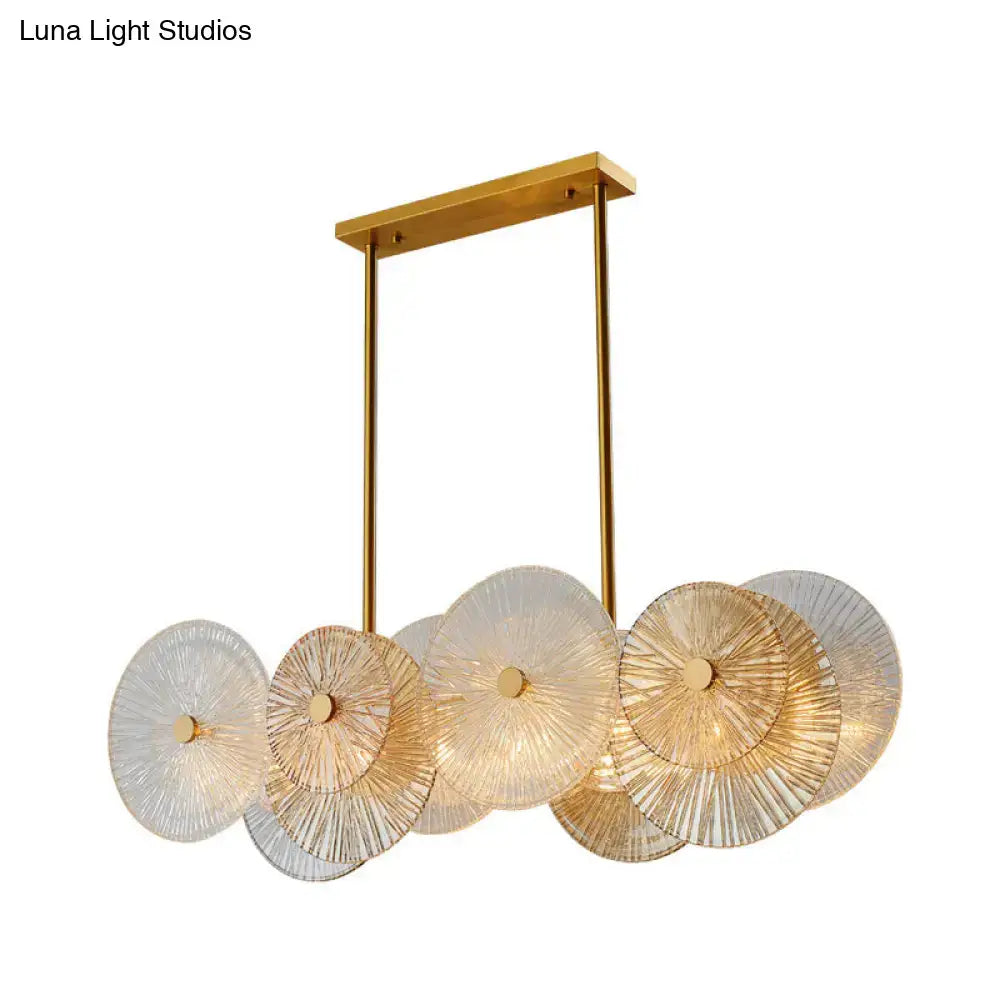 Modern gold finish pendant light with prismatic glass shade dining room