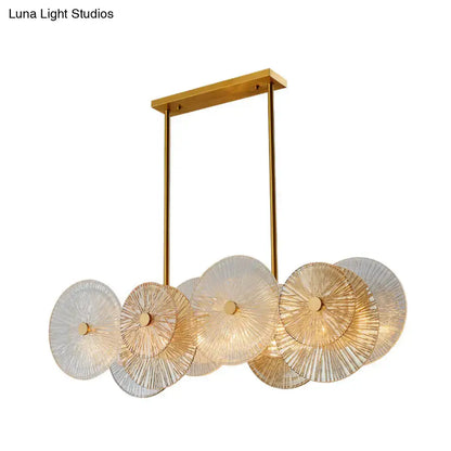 Modern gold finish pendant light with prismatic glass shade dining room