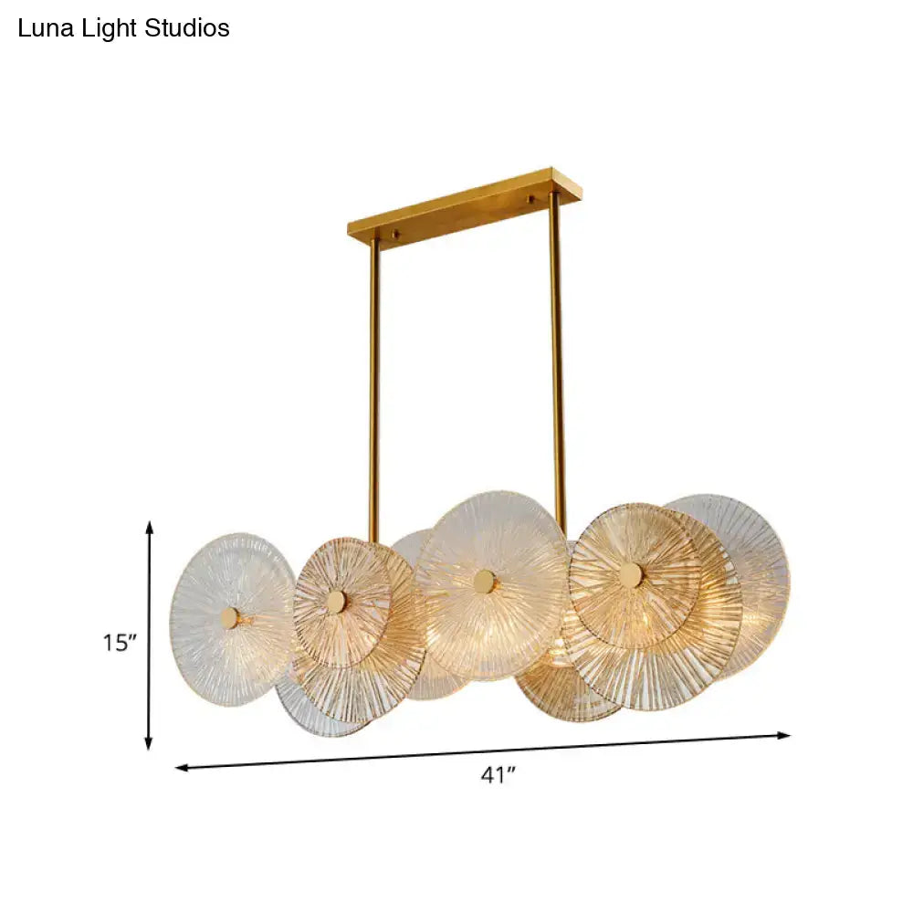 Modern gold finish pendant light with prismatic glass shade dining room