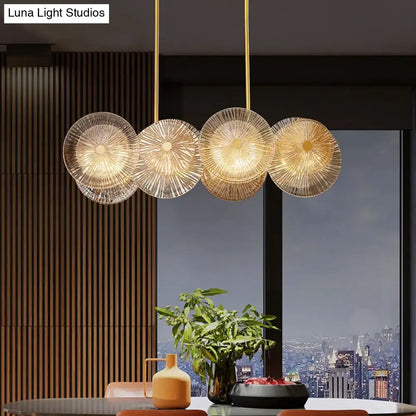 Modern gold finish pendant light with prismatic glass shade dining room