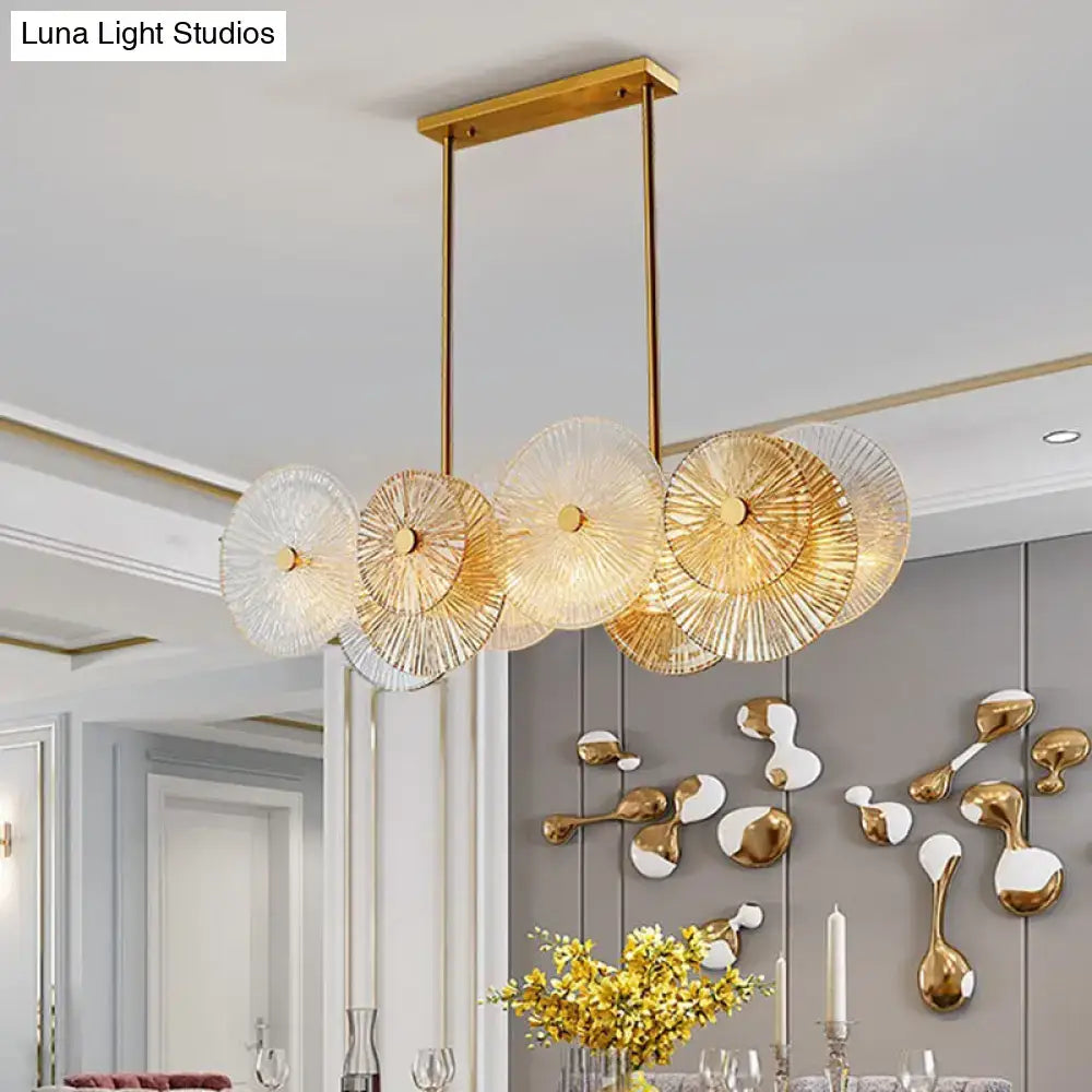 Modern gold finish pendant light with prismatic glass shade dining room