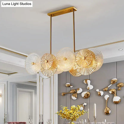 Modern gold finish pendant light with prismatic glass shade dining room