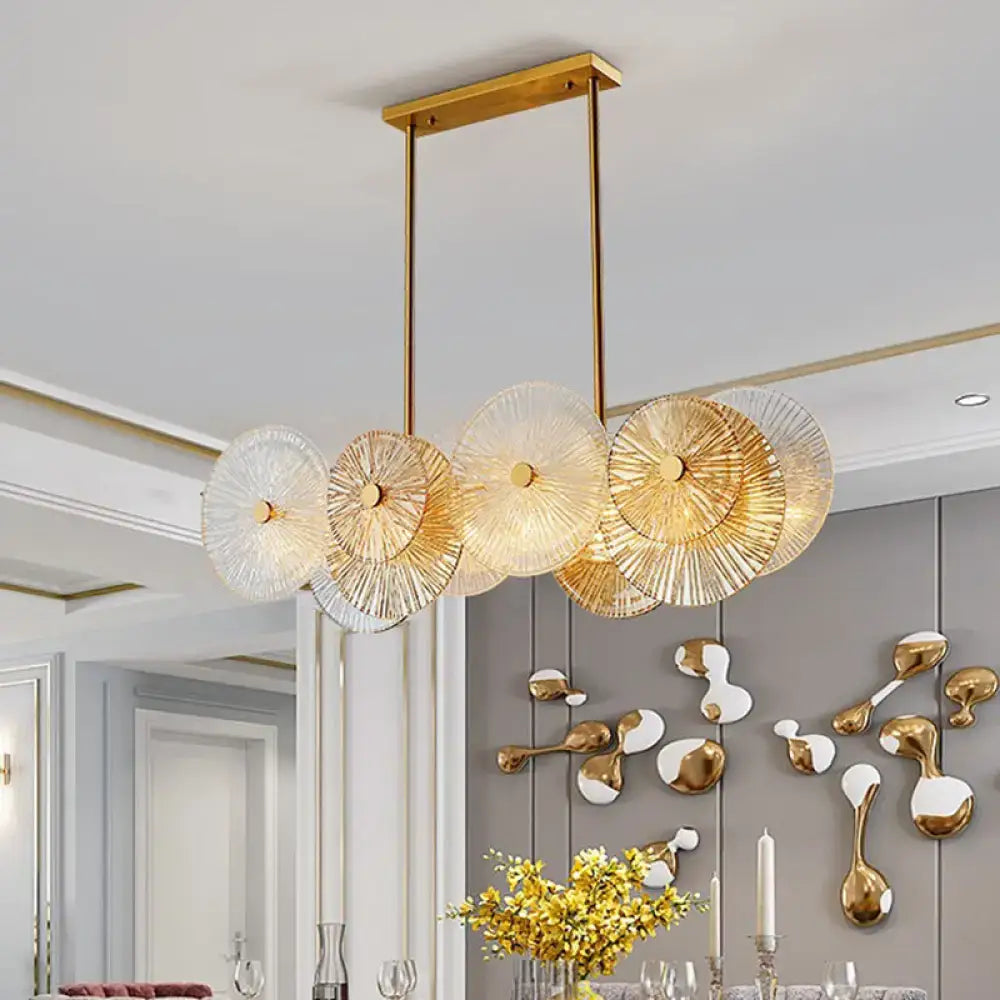 Modern gold finish pendant light with prismatic glass shade dining room