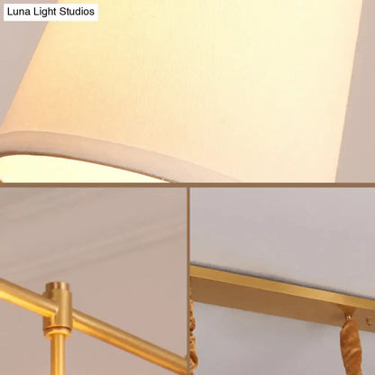 Modern gold island chandelier with fabric empire shade dining room