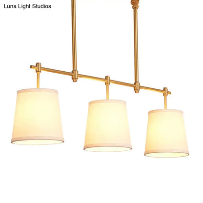 Modern gold island chandelier with fabric empire shade dining room