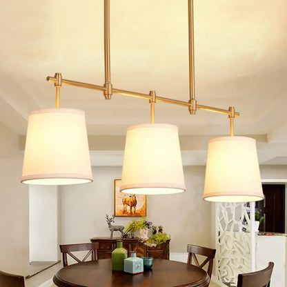 Modern gold island chandelier with fabric empire shade dining room