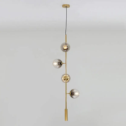Modern gold linear chandelier with gray glass shades dining room