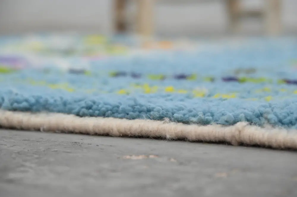 Blue geometric moroccan handmade azilal rug bedroom decor with tassels