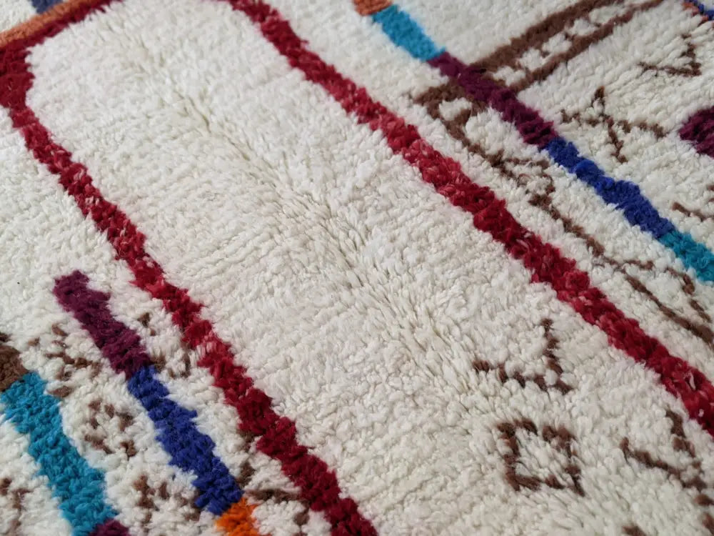 Handmade beige azilal rug with geometric patterns – living room decor