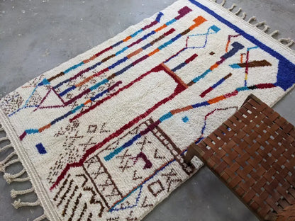 Handmade beige azilal rug with geometric patterns – living room decor