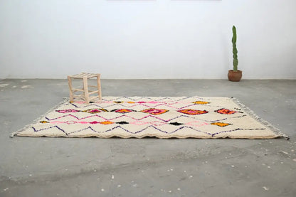 Handmade beige azilal rug with geometric patterns for living room