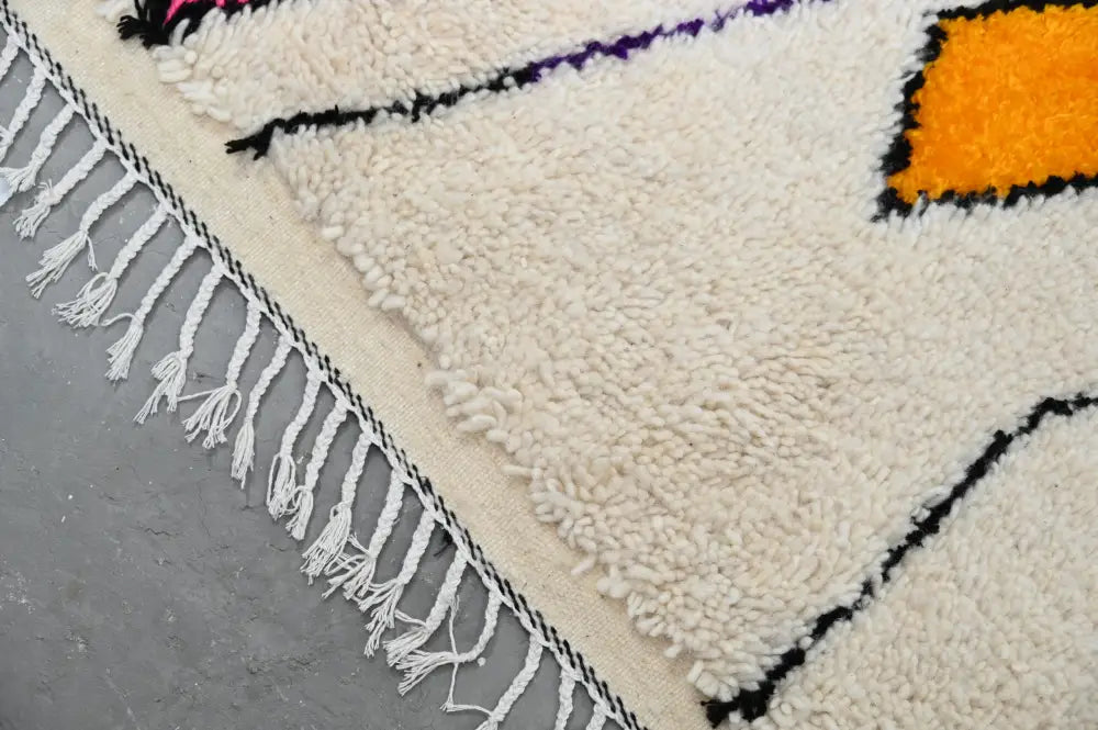 Handmade beige azilal rug with geometric patterns for living room