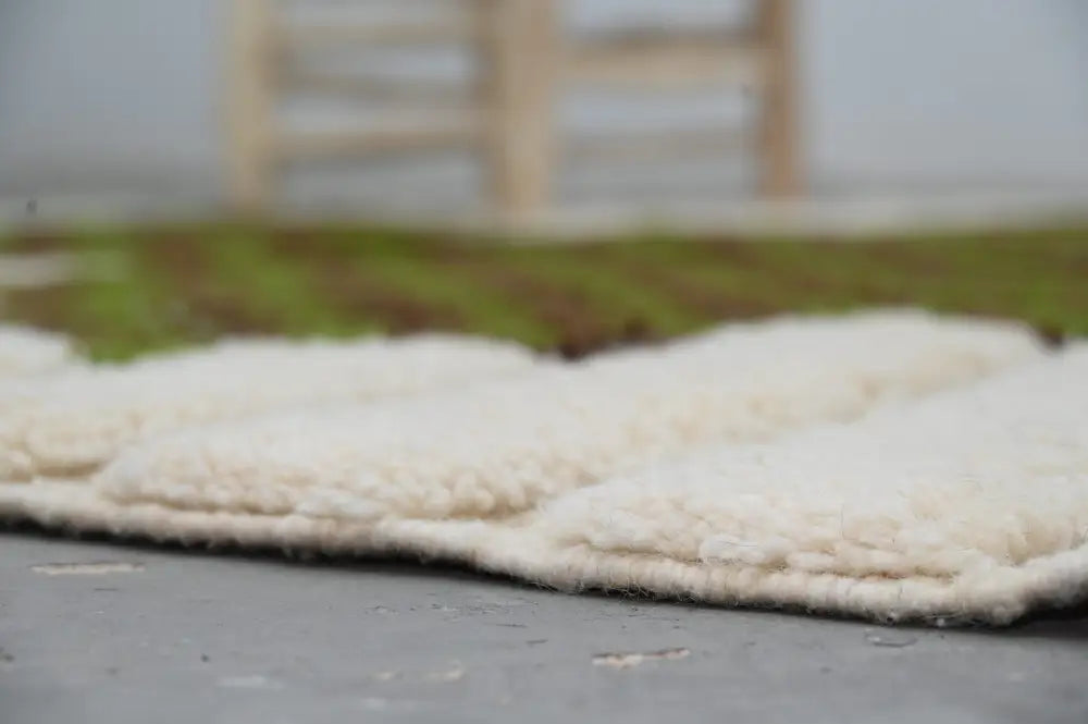 Traditional moroccan handmade cream & green azilal rug bedroom decor