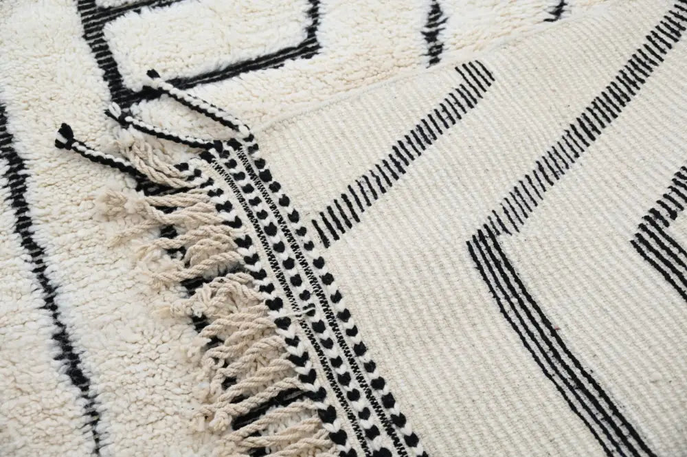 Handmade beni ouarain rug cream and black geometric living room decor