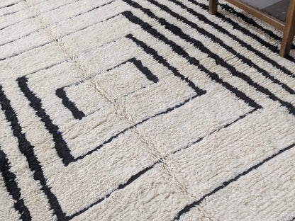 Handmade cream and black beni ouarain rug living room decor