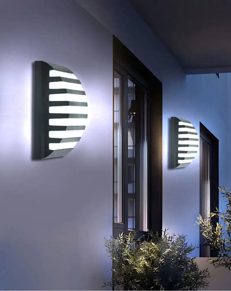 Modern black motion sensor outdoor wall light with frosted glass