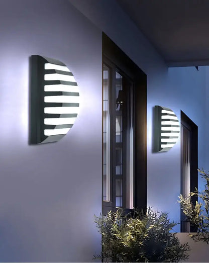 Modern black motion sensor outdoor wall light with frosted glass