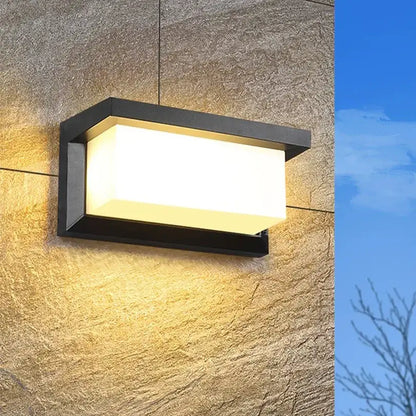 Modern black motion sensor outdoor wall light with frosted glass