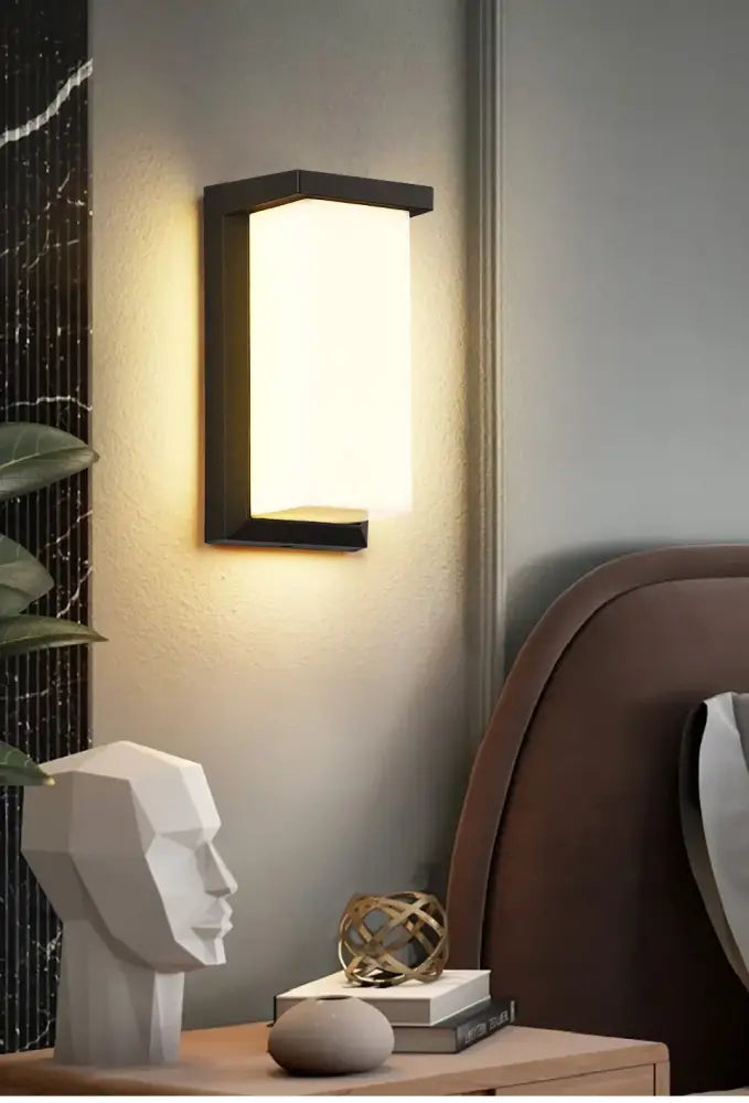 Modern black motion sensor outdoor wall light with frosted glass