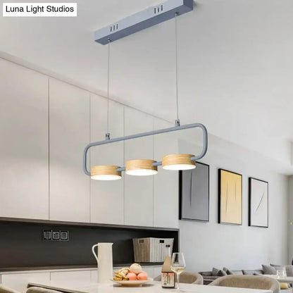 Modern mint green hanging pendant with wood accents for kitchen island