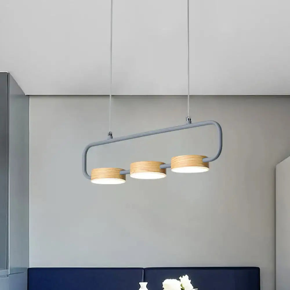 Modern mint green hanging pendant with wood accents for kitchen island