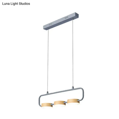 Modern mint green hanging pendant with wood accents for kitchen island