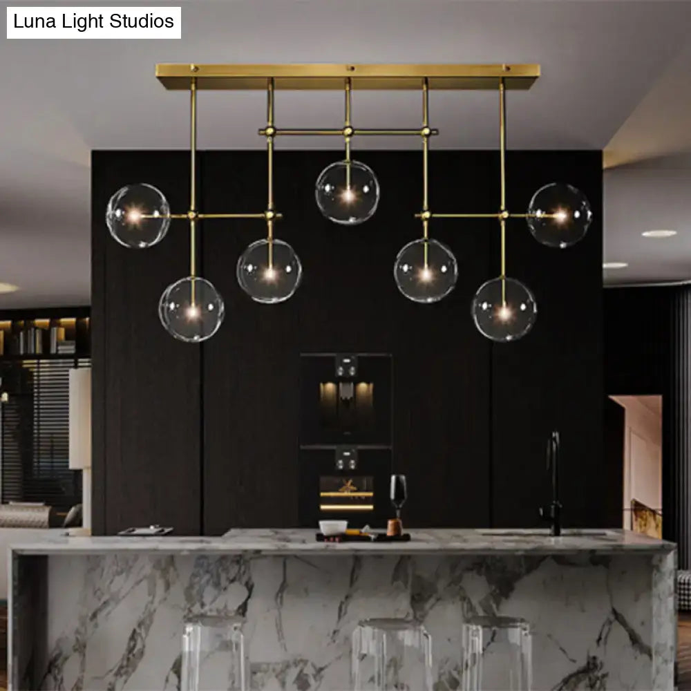 Modern brass and black clear glass sphere ceiling light dining room