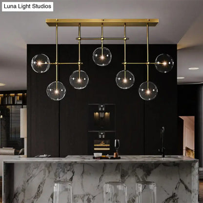 Modern brass and black clear glass sphere ceiling light dining room