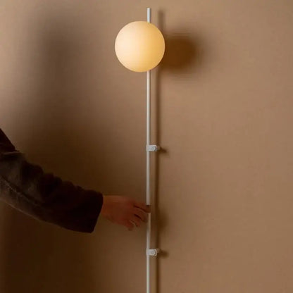 Minimalist white globe plug in wall lamp sconce – bedroom light