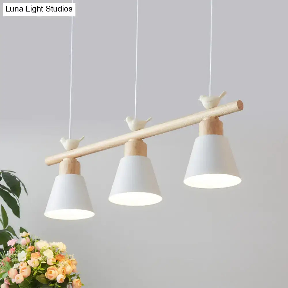 Minimalist wood and white bird hanging island light dining room