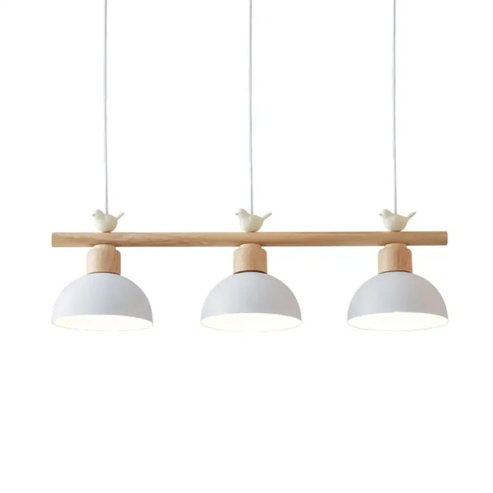 Minimalist wood and white bird hanging island light dining room